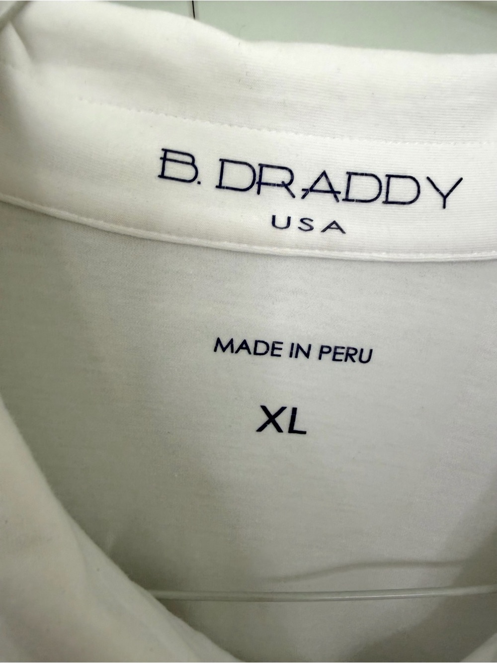 B.DRADDY Men’s Solid White Liam Polo with North Carolina flag and “B” Logo Patch - Picture 3 of 8